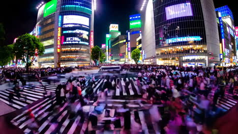 shinjuku crossing at night in tokyo, japan