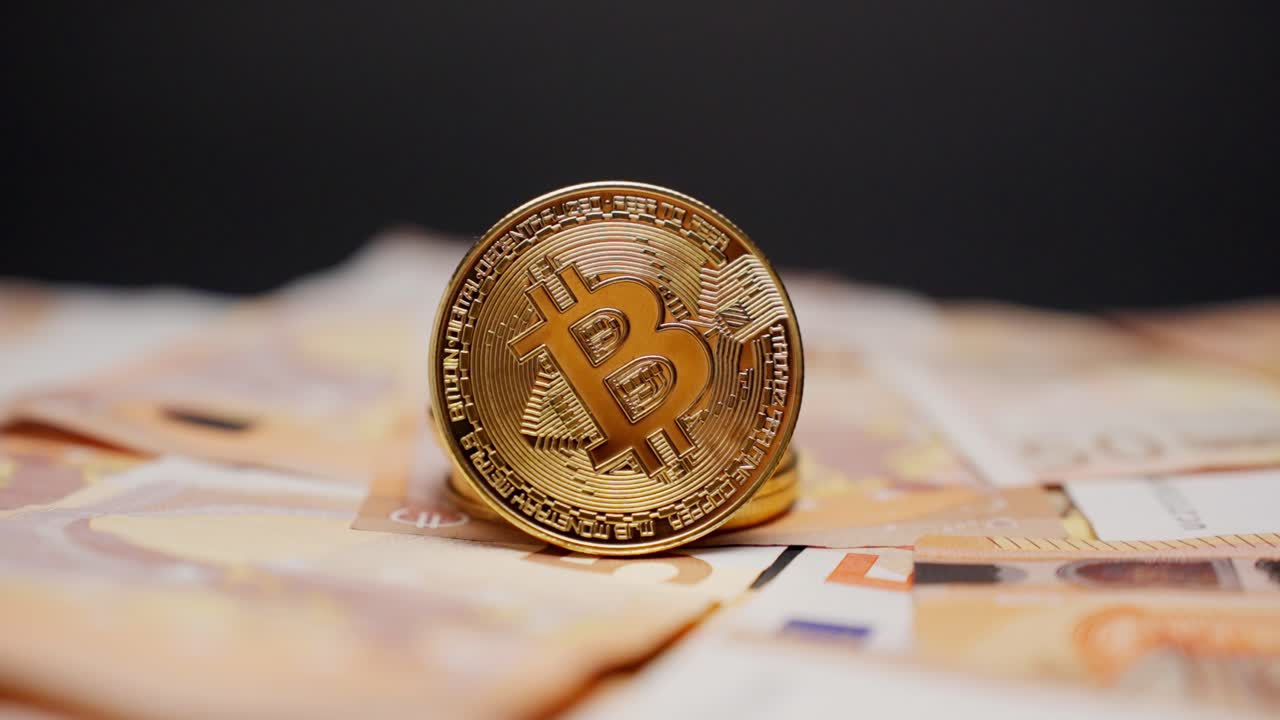 Bitcoin standing on euro cash with dark background, symbolizing digital finance