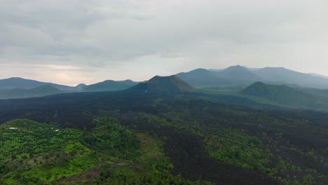 drone: dolly out shot of paricutin volcano in a cloudy day at michoacan mexico