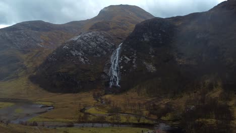 Beautiful-aerial-drone-video-of-Steall-Falls,-Scotland-on-a-cloudy-rainy-day