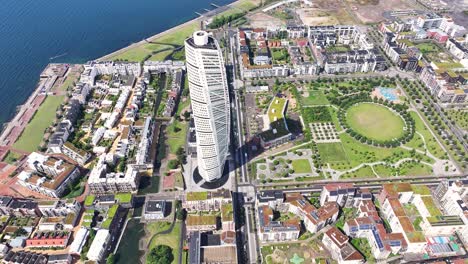 Beautiful-aerial-view-of-twisted-construction-of-Turning-Torso-skyscraper-in-Malmo,-Sweden