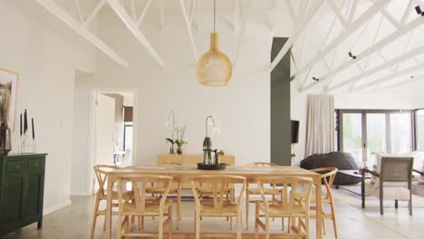 general view of luxury dining room with table and chairs