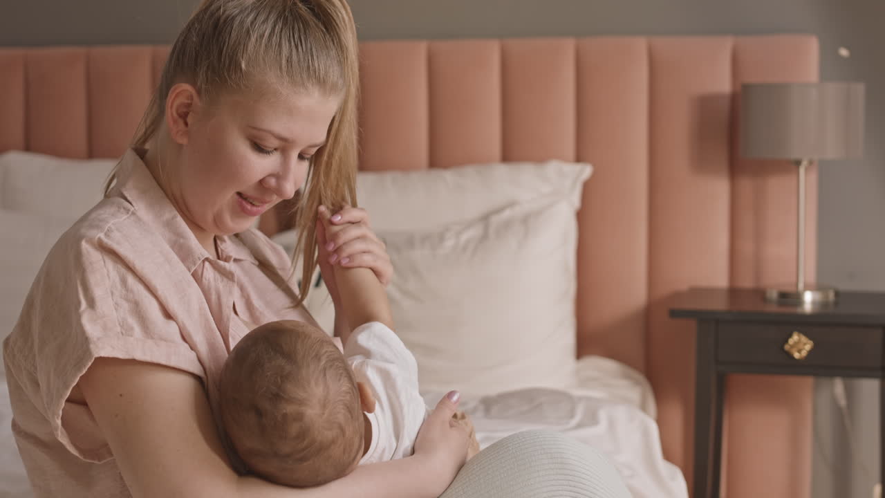 Caucasian Woman Breastfeeding Child