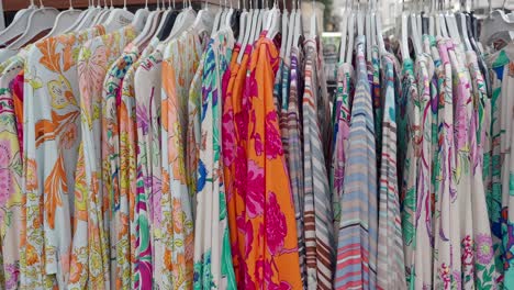 colorful women's tops and dresses on display