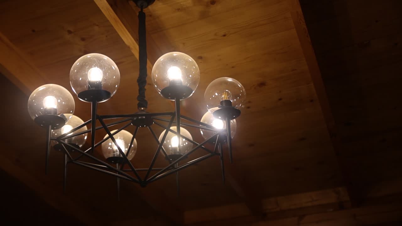 Close up circling gimbal shot of lighted chandelier