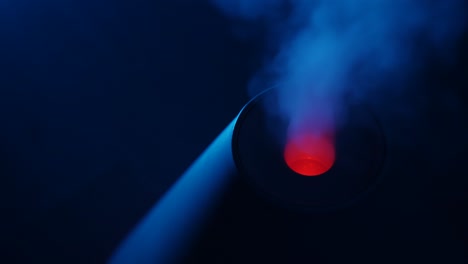 working a humidifier with a red circular light in the middle