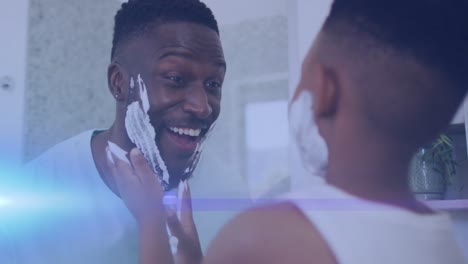 animación de luces sobre un feliz padre y hijo afroamericanos afeitándose y divirtiéndose