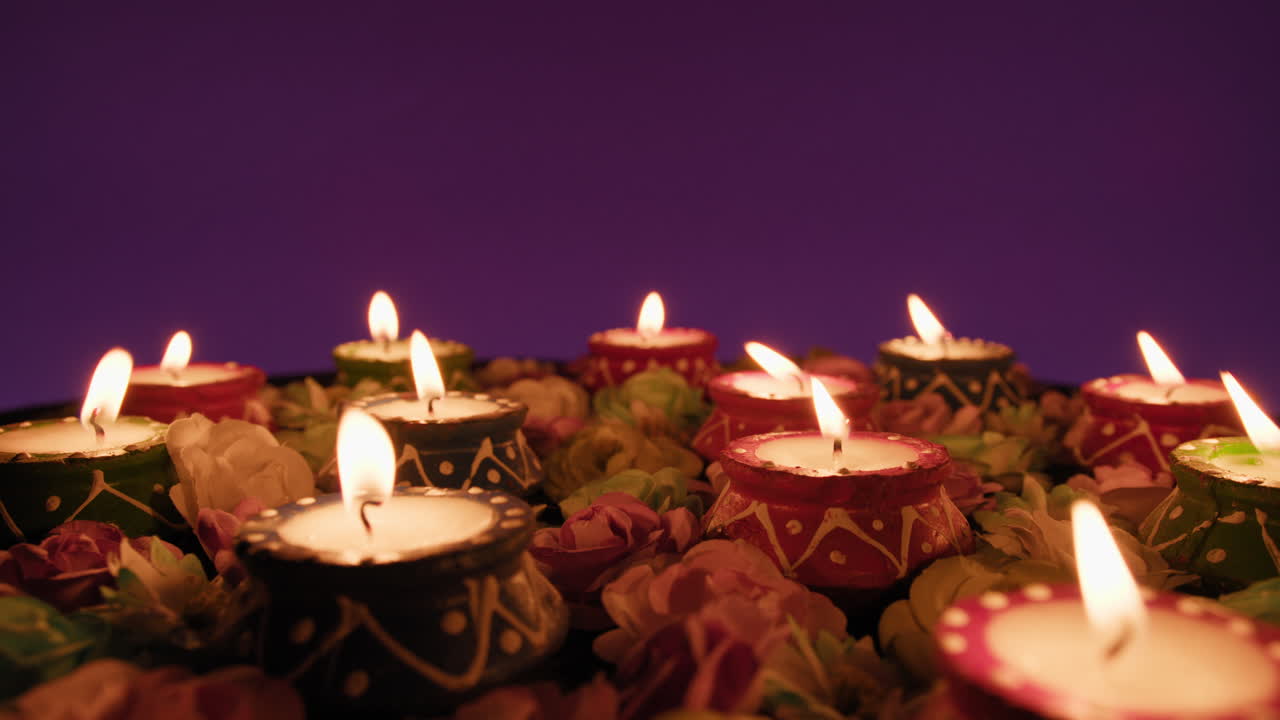 Lit candles circulate for the Indian festival of Diwali