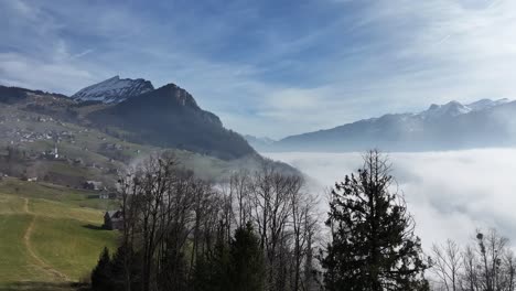 foggy walensee with churfirsten peaks. switzerland aerial