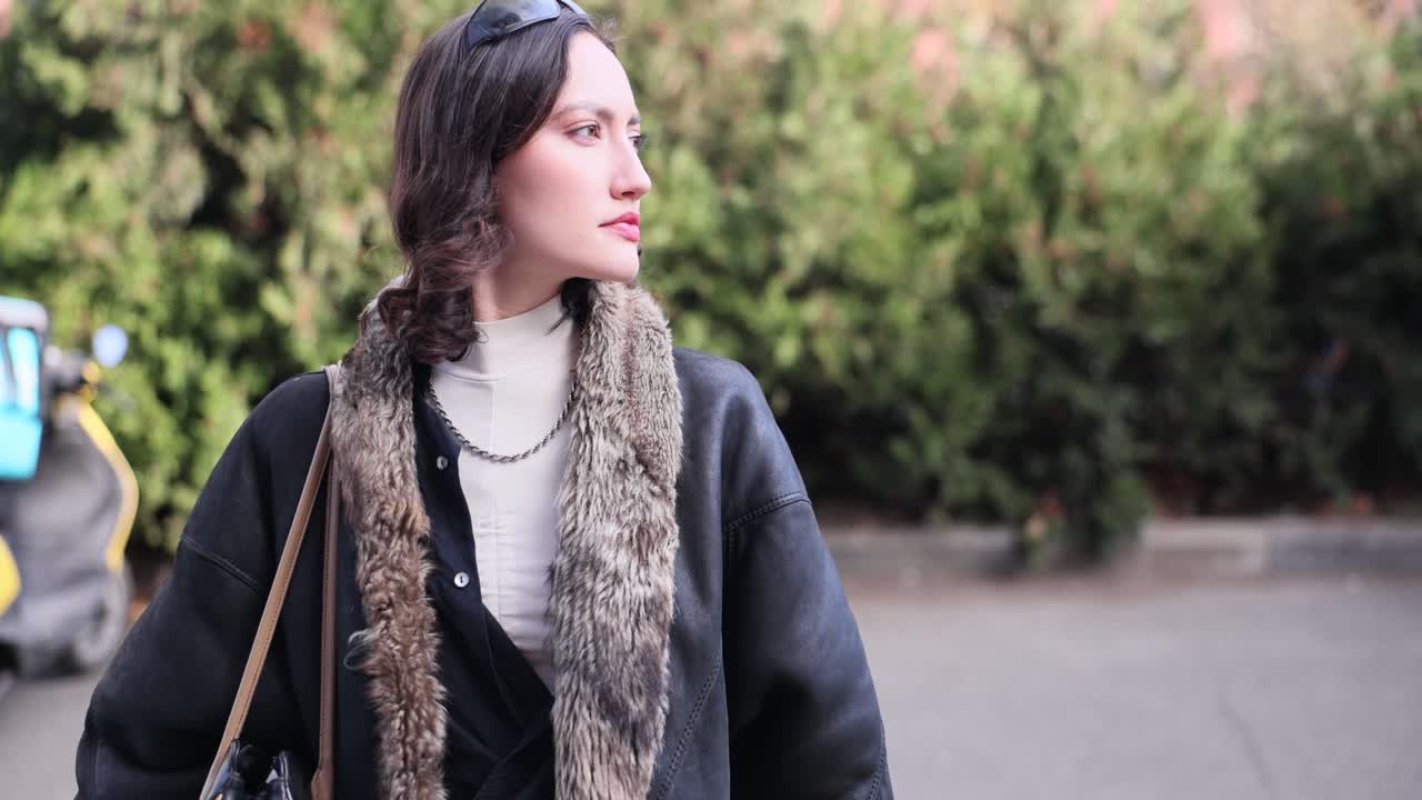 Stylish woman in winter fashion posing outdoors