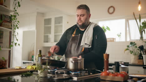 man cooking in a kitchen