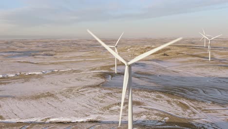 Aerial-shots-of-wind-turbines-on-a-cold-winter-afternoon-in-Calhan,-Colorado