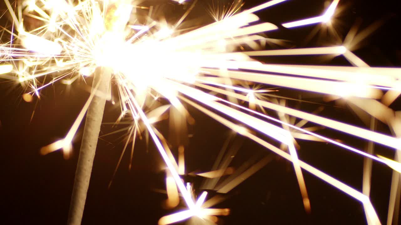 Christmas sparkler. On a black background.