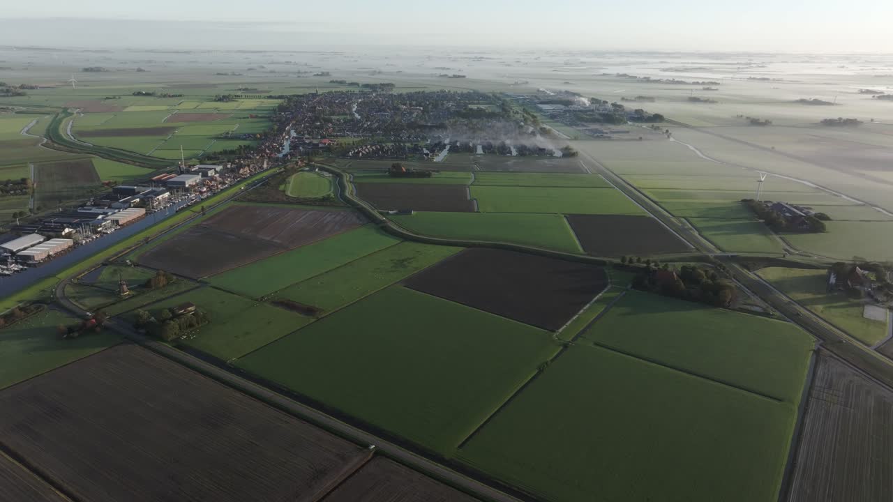 Aerial view of farmland and fields during a foggy morning, Workum, Netherlands