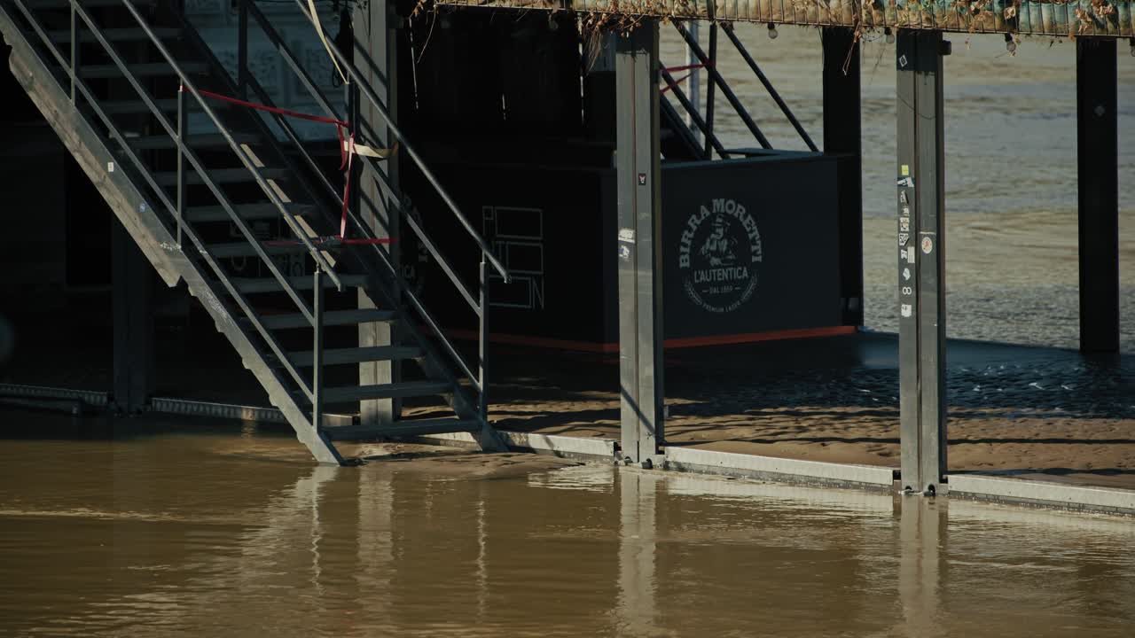 Flooded stairs leading to a riverside structure in Budapest, Hungary during 2024 flood