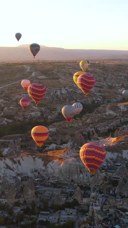hot air balloons soaring over cappadocia at sunrise