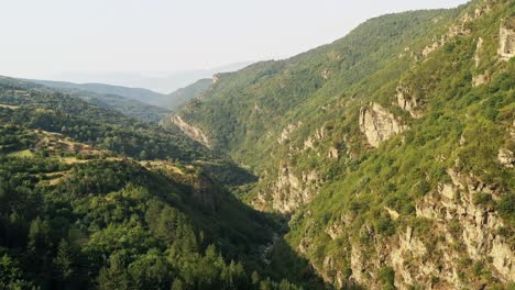 aerial view into the shadows over ravines and gorge of rhodope mountains bulgaria