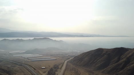 Drone-flies-high-above-mountains-and-clouds