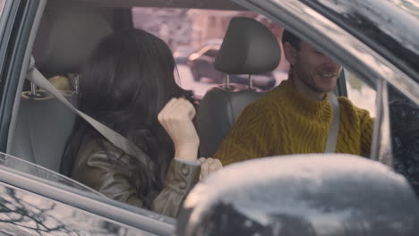 Husband-And-Wife-Sitting-In-The-Front-Seats-Of-A-Car-1