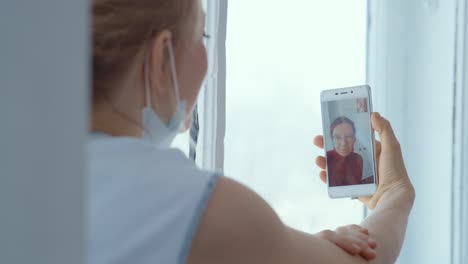 woman on video call with a mask