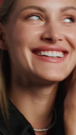 woman putting on earrings