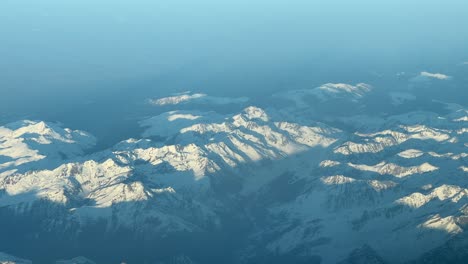 aerial panoramic view of the pyrenees mountains from a jet cockpit