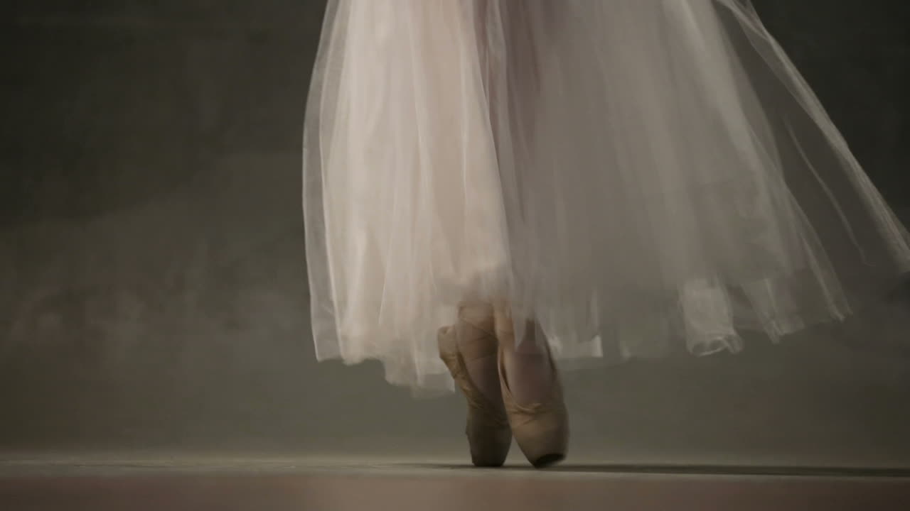 Ballerina In Ballet Studio. Young ballerina standing on poite in ballet studio