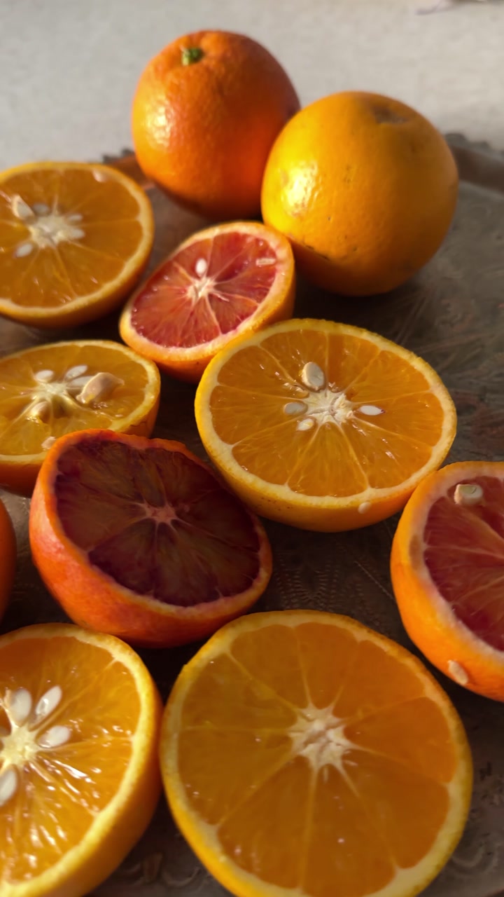 Vertical shot and close up orange juice prep making cut round fruit fresh healthy drink squeeze homemade tasty pulpy organic breakfast slice citrus delicious Persian wellness colorful freshness winter