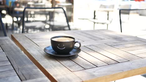 close-up of a cup of coffee on a table at a cafe