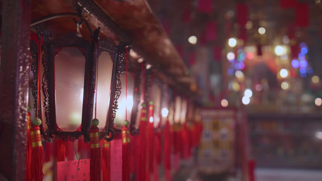 Illuminated Red Lanterns Hanging in a Chinese Temple