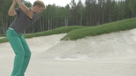 golf player in sand trap
