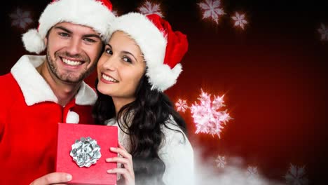 Pareja-De-Invierno-De-Navidad-Con-Copos-De-Nieve-Y-Regalo