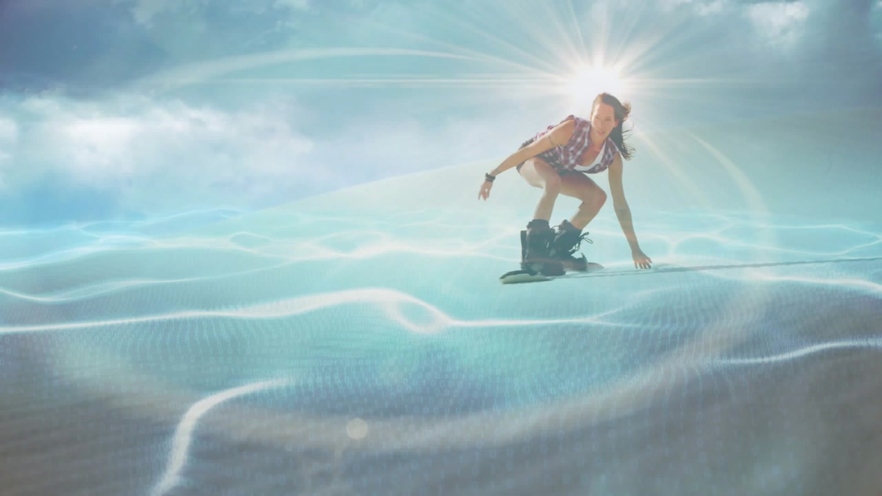 Woman riding wakeboard approaching cam, dropping low for balance as sports ripples around rider