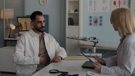 doctor consulting with patient in clinic
