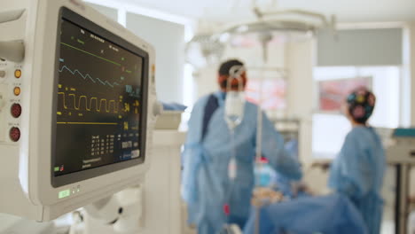 operating room scene with medical equipment and personnel