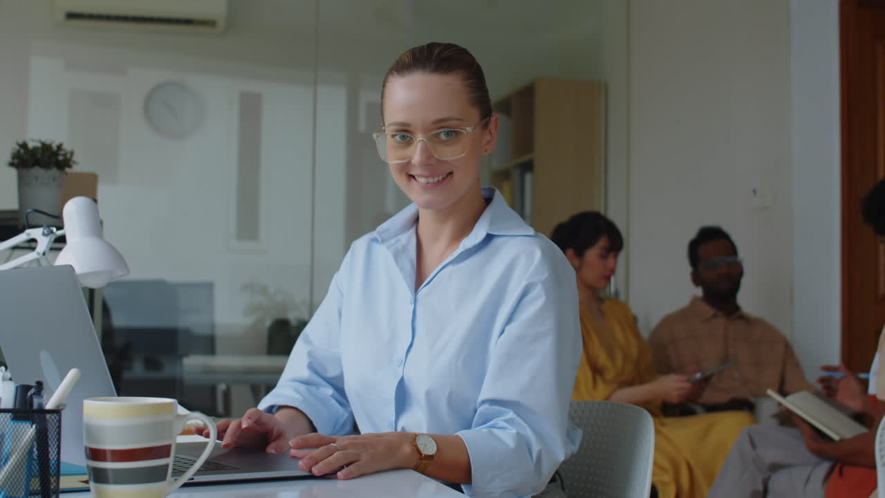 Portrait of Female Project Manager Working on Laptop