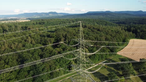 high voltage transmission tower over rural landscape