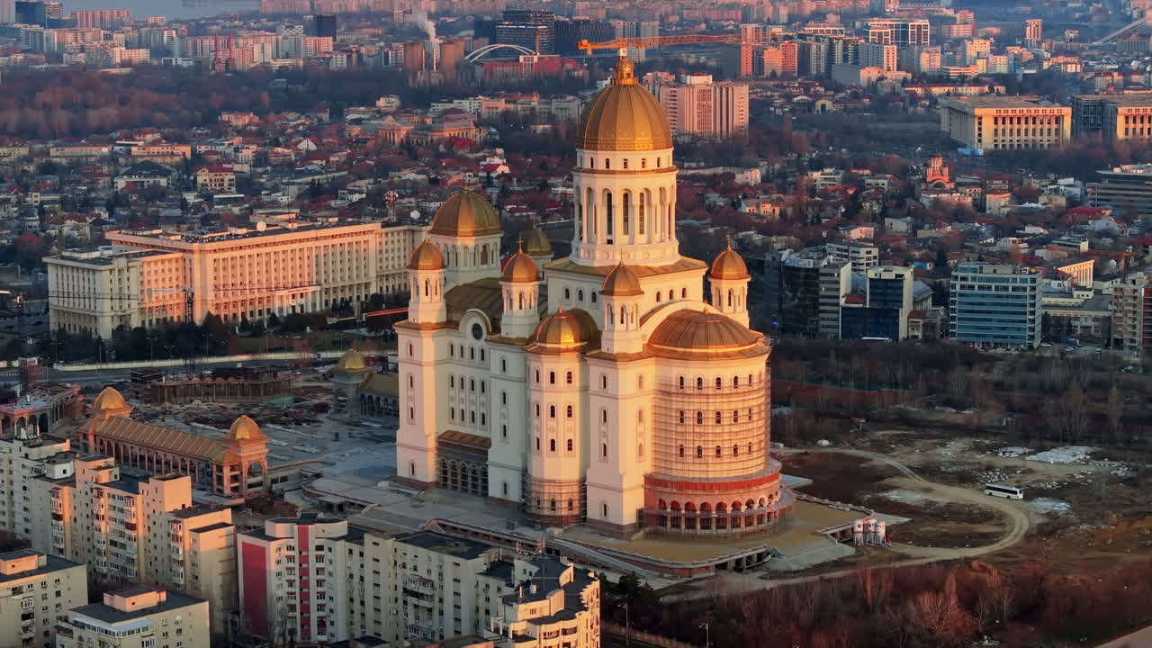 Aerial drone view of People's Salvation Cathedral near the Palace of the Parliament. Sunset in Bucharest, Romania