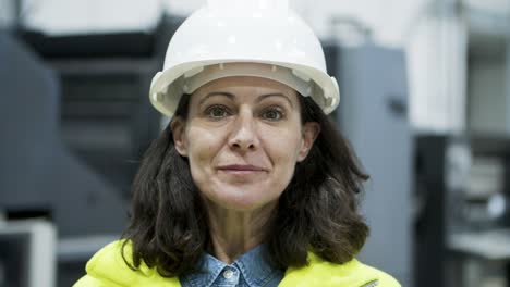 closeup view of smiling female technician looking at camera