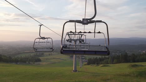 panorama with empty ski lift during summer, dolly shot