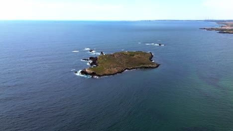 aerial view of rugged coast line with blue ocean and waves crashing, portugal, 4k