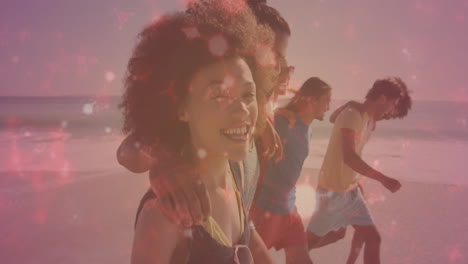 friends walking arm-in-arm on beach at sunset, with health data chart and heart icon floating