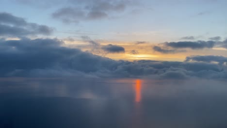 aerrial view of a sunset over the mediterranean sea with a beautifull red sunbeam over the sea