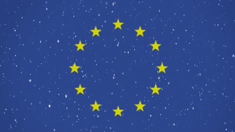 nieve cayendo con la bandera de la unión europea