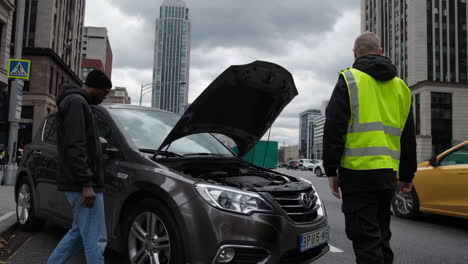car trouble on city street