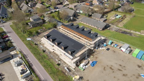 cinematic aerial of construction site with new homes with solar panels on rooftop