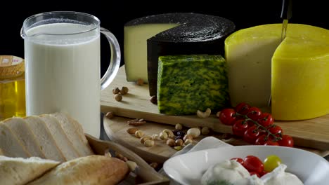 assorted cheeses, milk, and bread