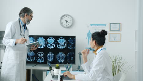 medical consultation with brain scan analysis