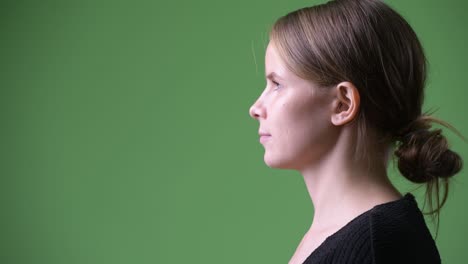 closeup profile view of young beautiful businesswoman with blond hair