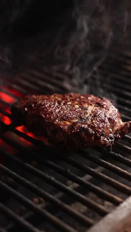 steak grilling on charcoal grill